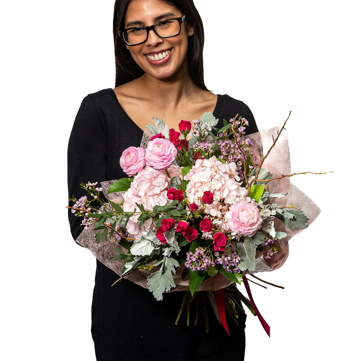 Sweet Candy bouquet of pink and red roses with eucalyptus, held by a florist