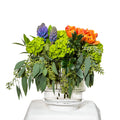Spring Vibes arrangement of orange tulips, purple hyacinth and green euphorbia in a glass vase