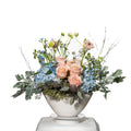 Morning Breeze arrangement of blue hydrangea, peach roses and dusty miller in a silver bowl