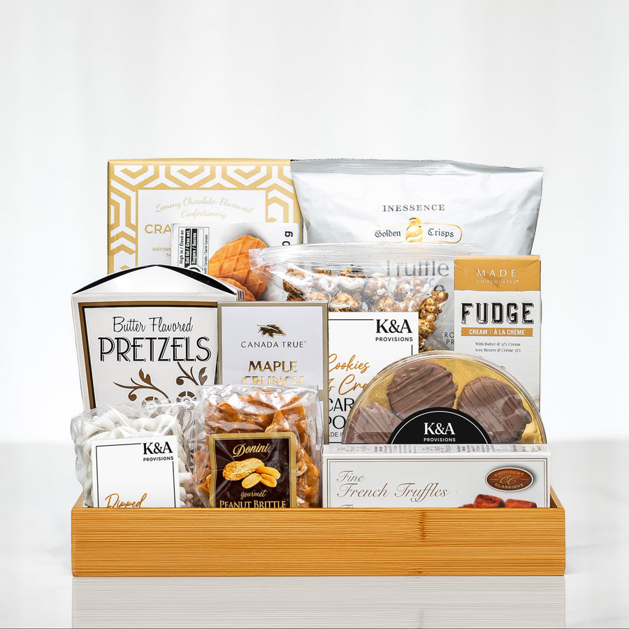 All for One small gourmet gift basket on a wooden tray with pretzels, fudge, maple cookies and snacks