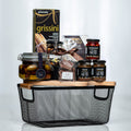 Artisan Collection small black wire basket with grissini, preserves, olives and chocolates