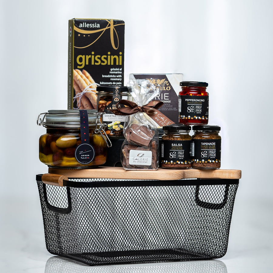 Artisan Collection small black wire basket with grissini, preserves, olives and chocolates