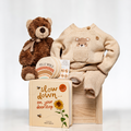 Bear Necessities baby gift with a brown plush teddy, a knitted bear sweater and a keepsake book