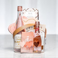 Blushing Bubbly gift with a bottle of rose sparkling wine, chocolates and pink treats