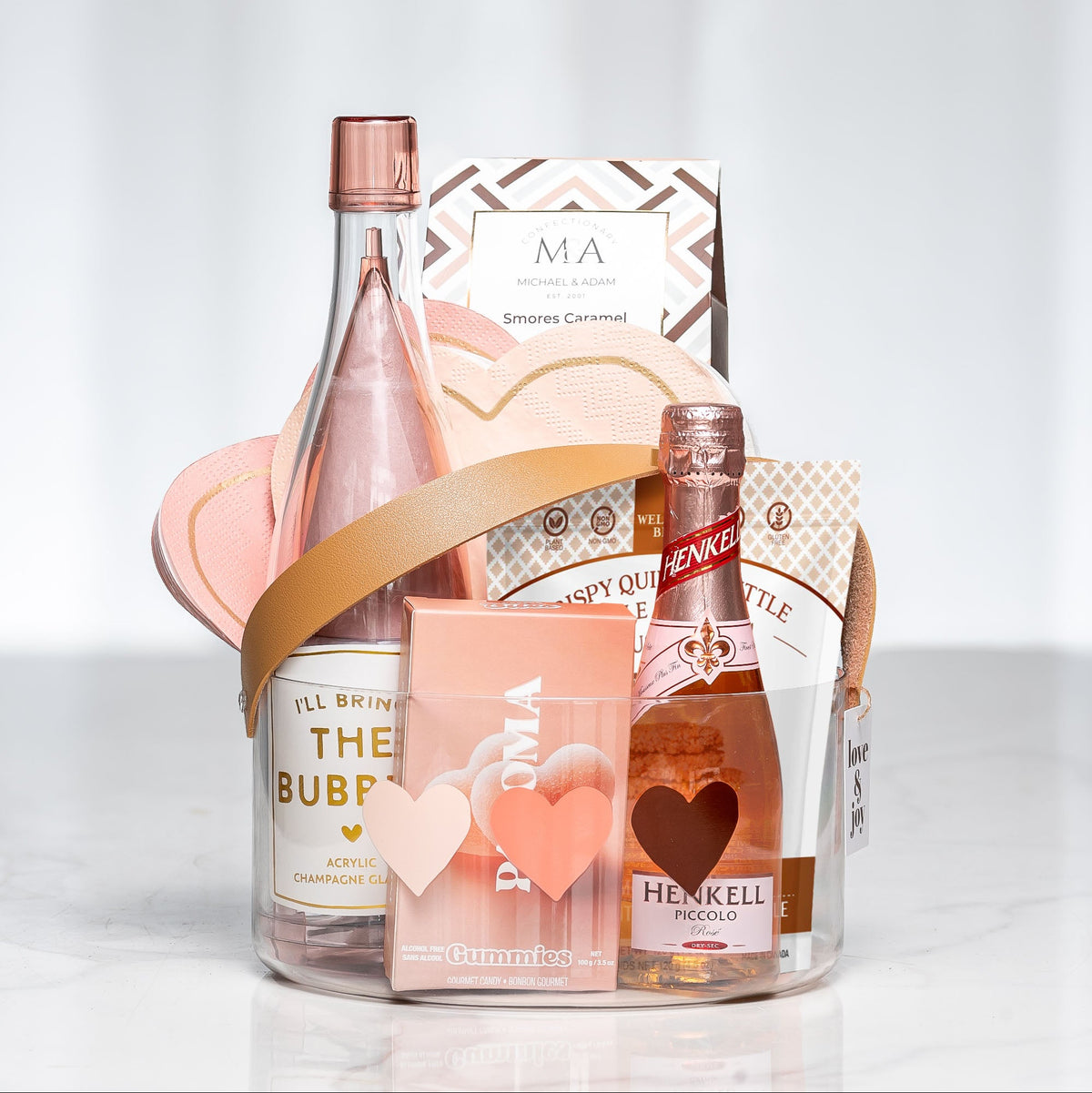 Blushing Bubbly gift with a bottle of rose sparkling wine, chocolates and pink treats