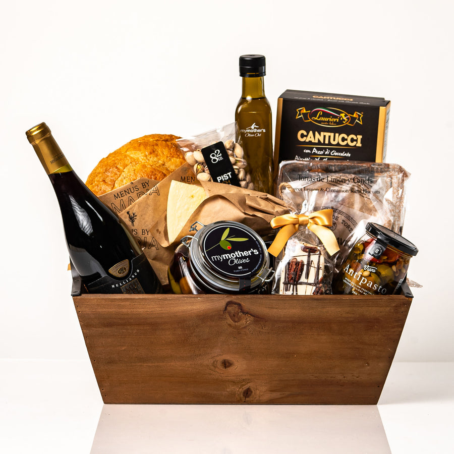 Bread Hamper Large: a tapered wood tray with a fresh sourdough loaf, a bottle of red wine, My Mother's olive oil and olives, antipasto, Parmigiano, cantucci and pistachios