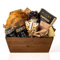 Bread Hamper Small: a tapered wood tray with a fresh sourdough loaf, a Parmigiano wedge, Laurieri cantucci, olive oil taralli, Co. 82 jars and a Venchi chocolate bar