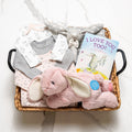 Bunny Bundle baby girl gift basket with onesies, a pink plush bunny and the book I Love You Too