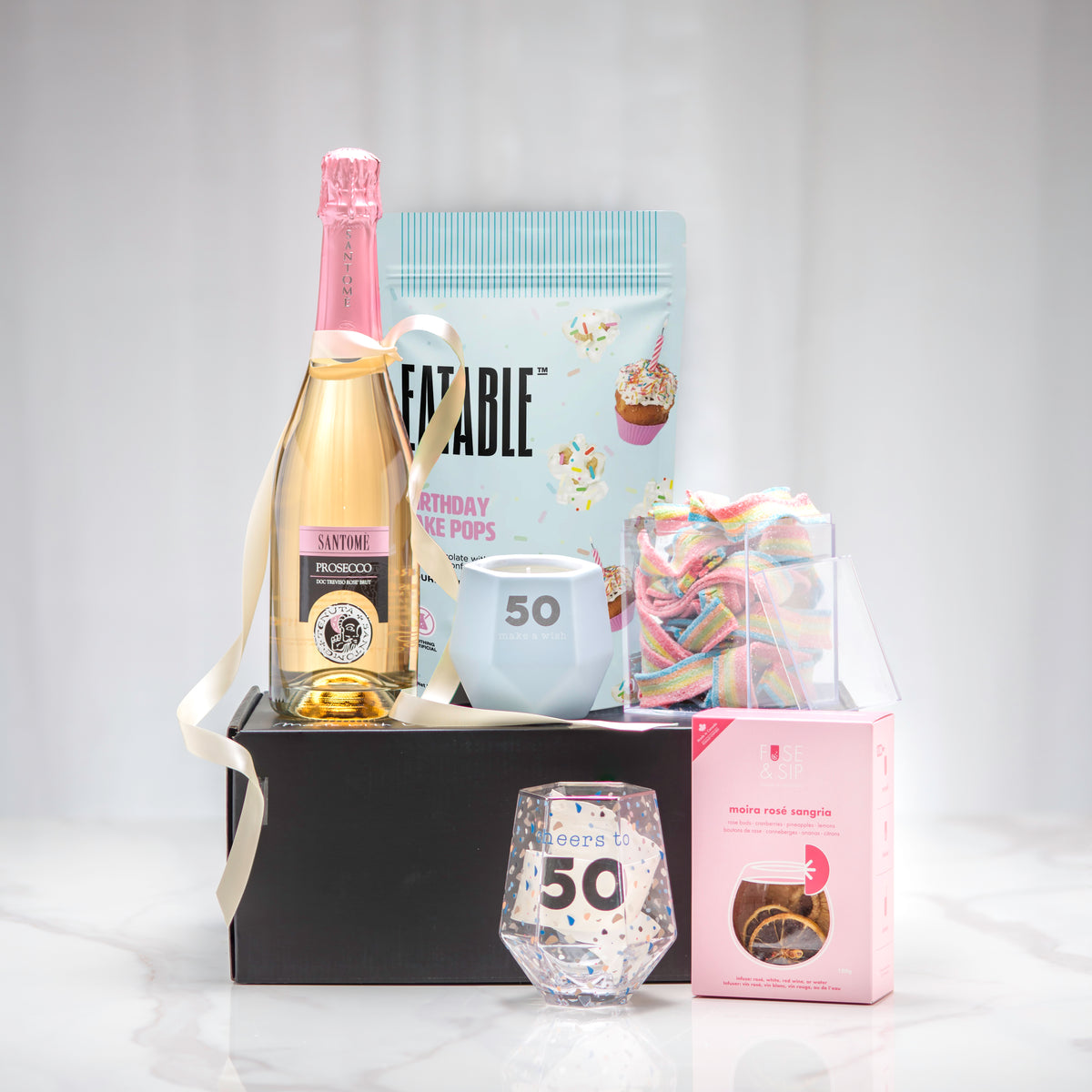 Cheers to You 50th birthday gift set with sparkling wine, a 50 stemless glass and cookie pops