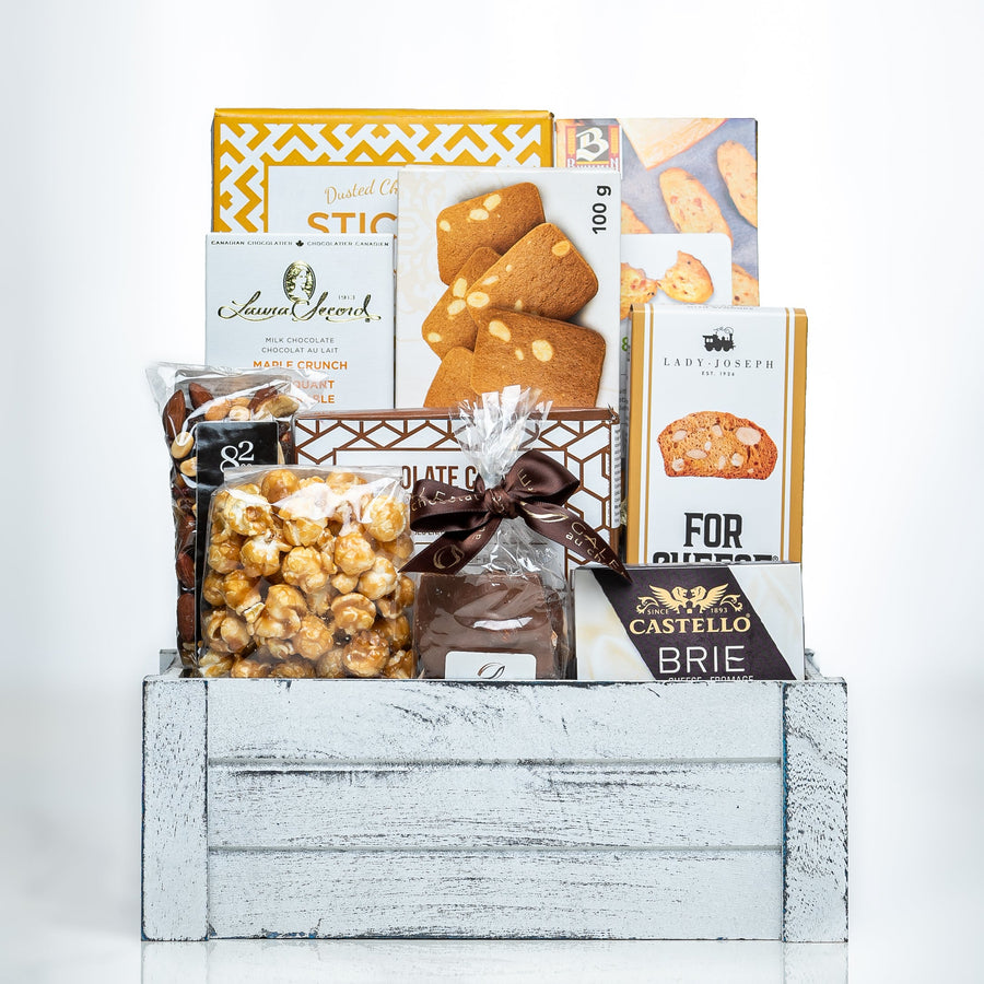 Comfort Collection small white crate with sticks, brie, chocolate covered peanuts and cookies