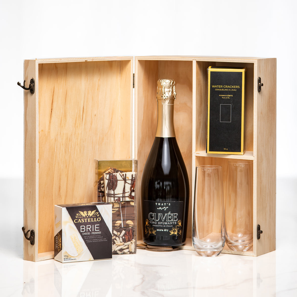 Congratulations gift, a bottle of sparkling wine and two glasses in a hinged wooden presentation box