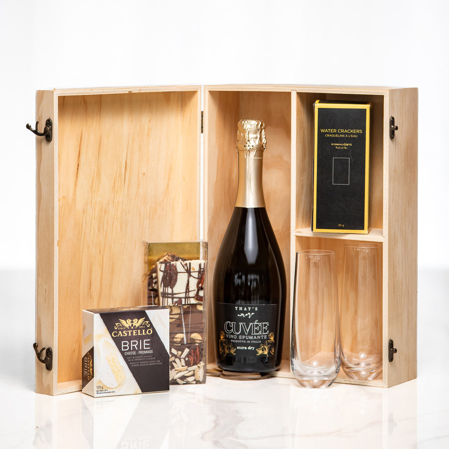 Congratulations gift, a bottle of sparkling wine and two glasses in a hinged wooden presentation box