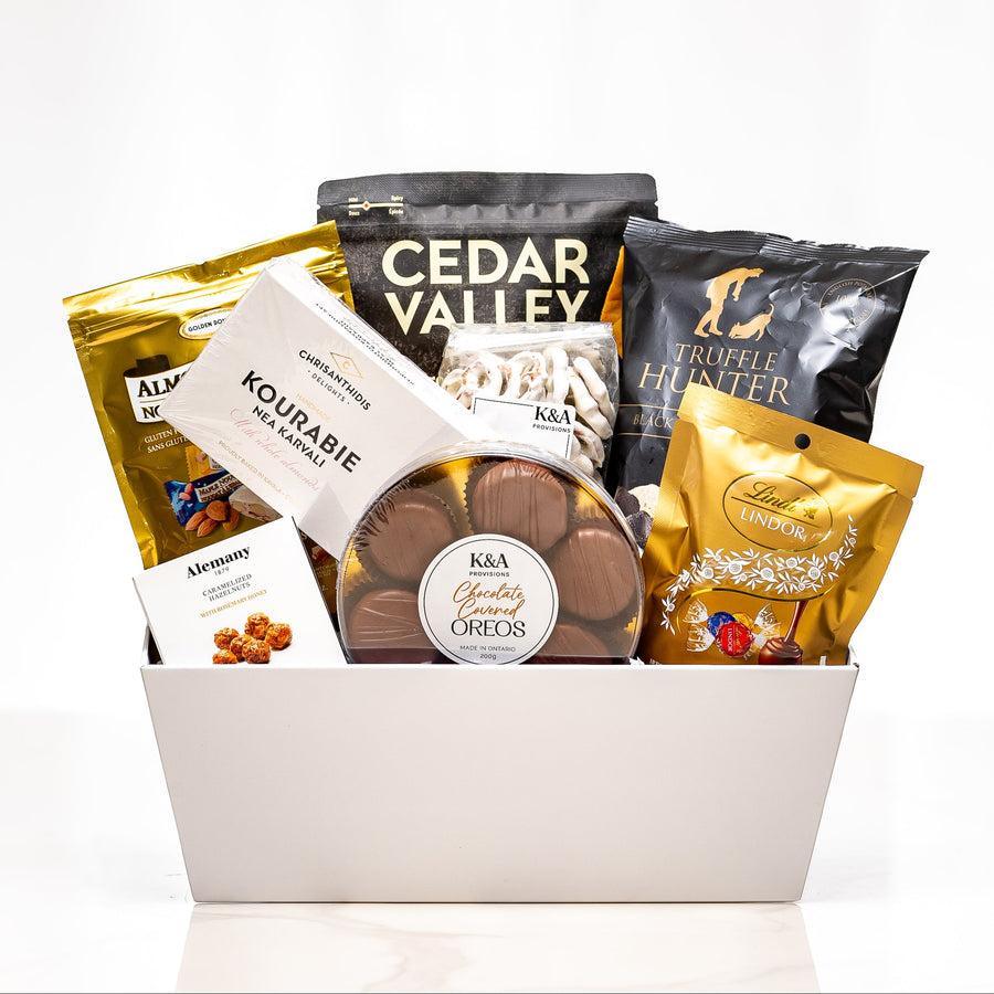 Crafted Cravings large white tub with Cedar Valley crackers, Hardbite chips, truffles and nuts