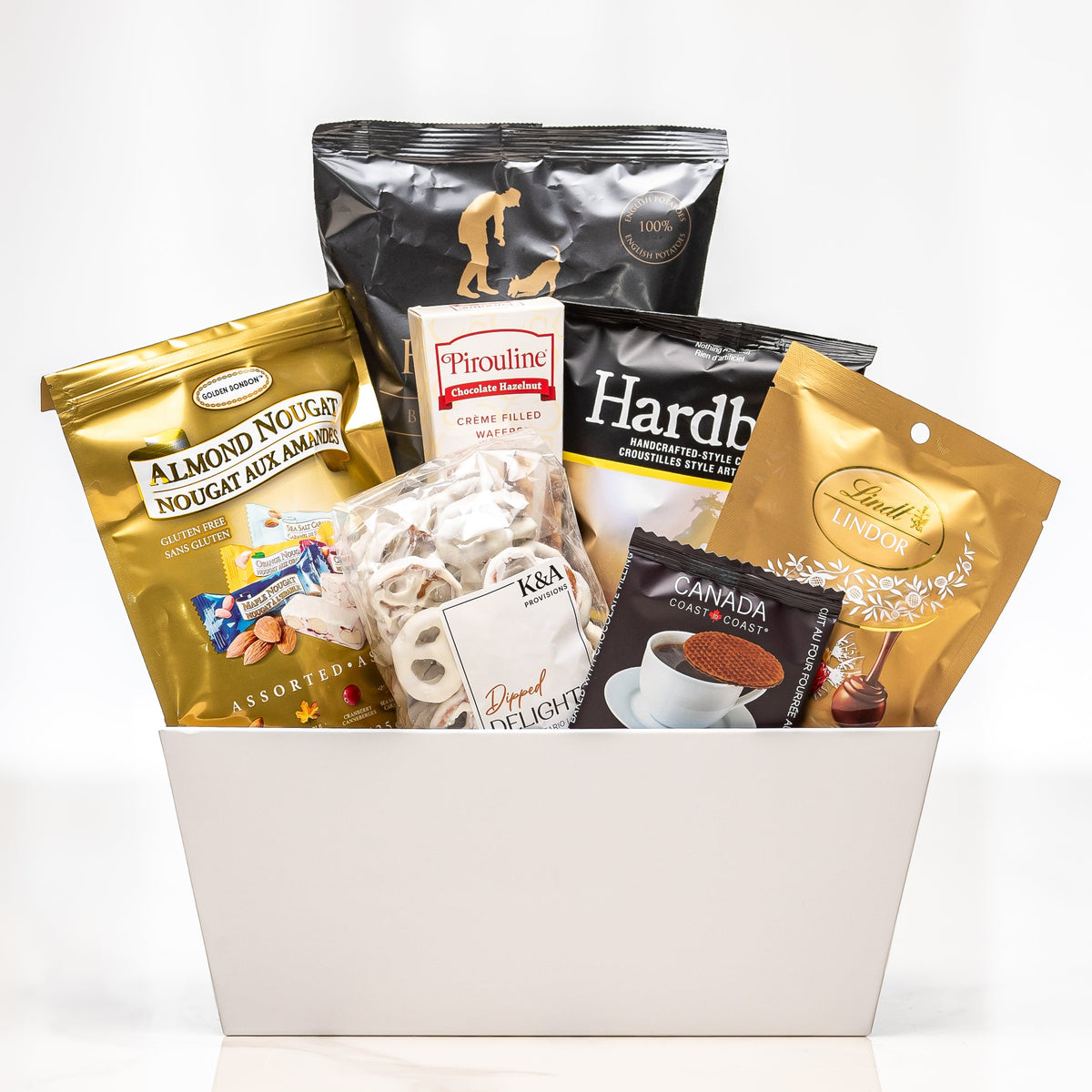 Crafted Cravings small white tub with almond nougat, Hardbite chips, meringues and chocolates