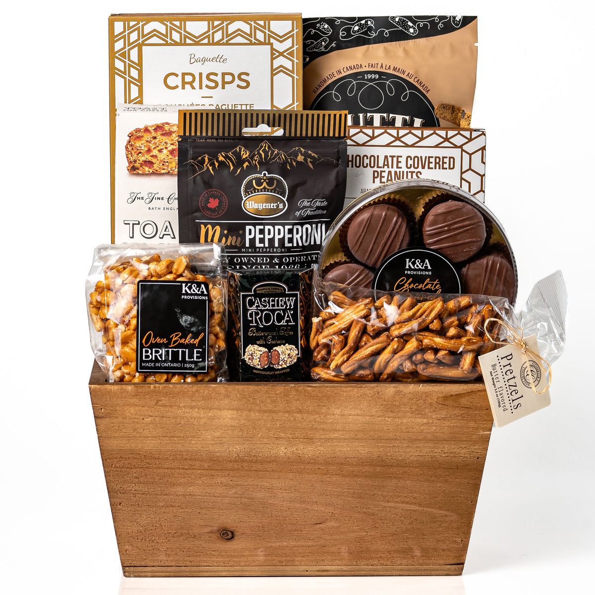 Cravings gift: a wood tapered market tray with baguette crisps, mini pepperoni, chocolate covered peanuts, cashew roca, oven baked brittle, pretzels and chocolate covered Oreos