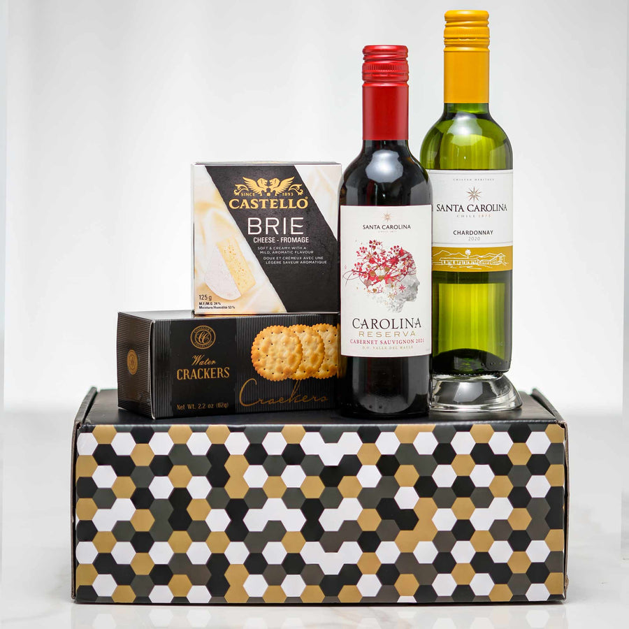 Double Wine Tasting gift with a bottle of red and a bottle of white wine, brie and crackers on a patterned box