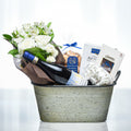 Elegance small gift in a galvanised tub with white roses, sparkling wine and gourmet treats
