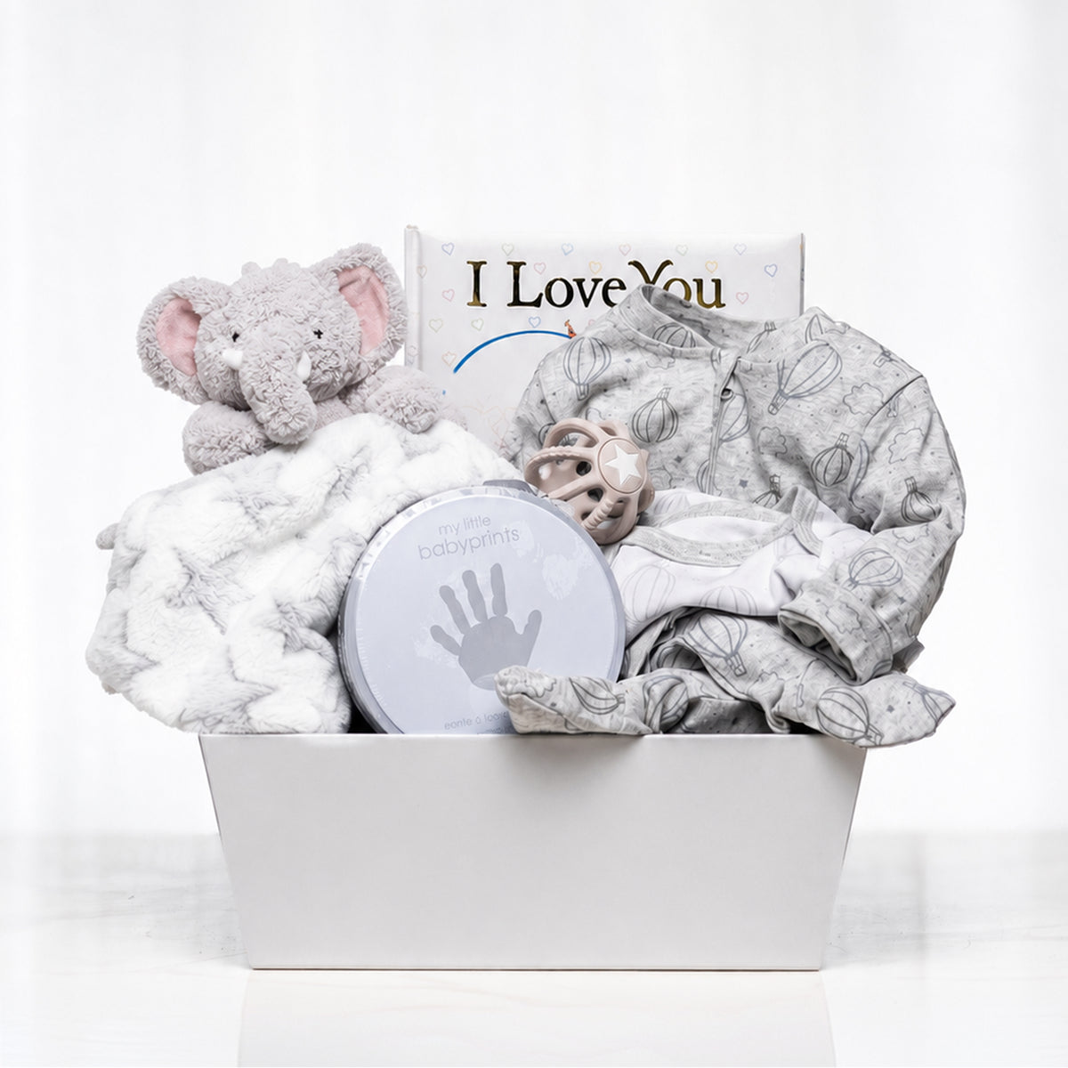 Elephant Embrace baby gift with a grey plush elephant, a blanket, a keepsake box and an I Love You sign