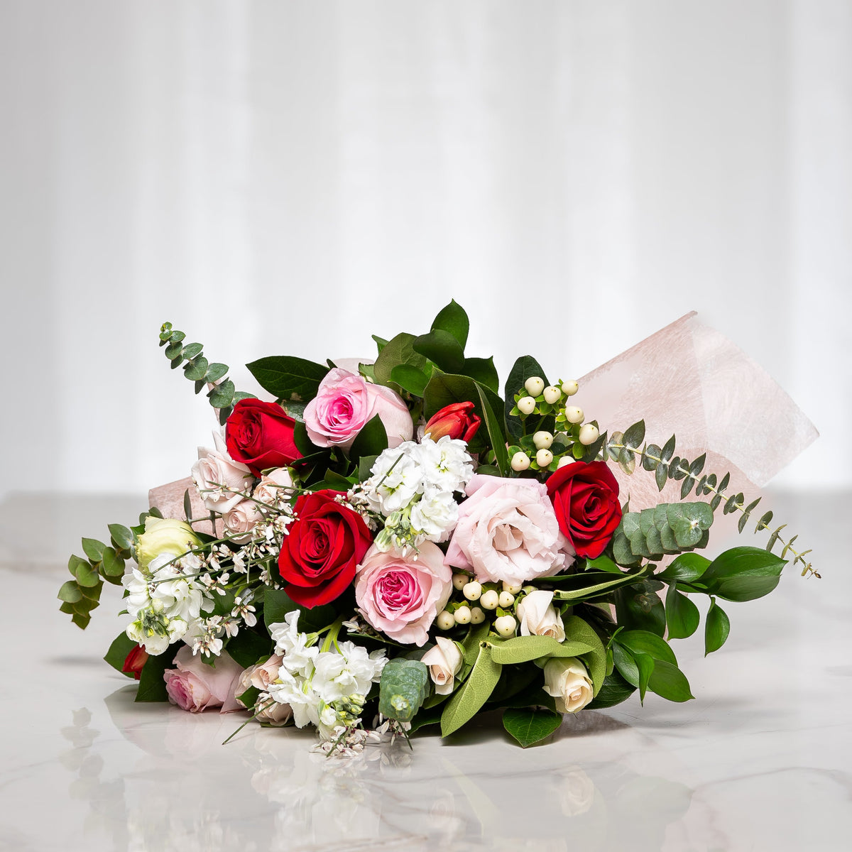 Forever Yours bouquet of red and pink roses with white blooms and eucalyptus