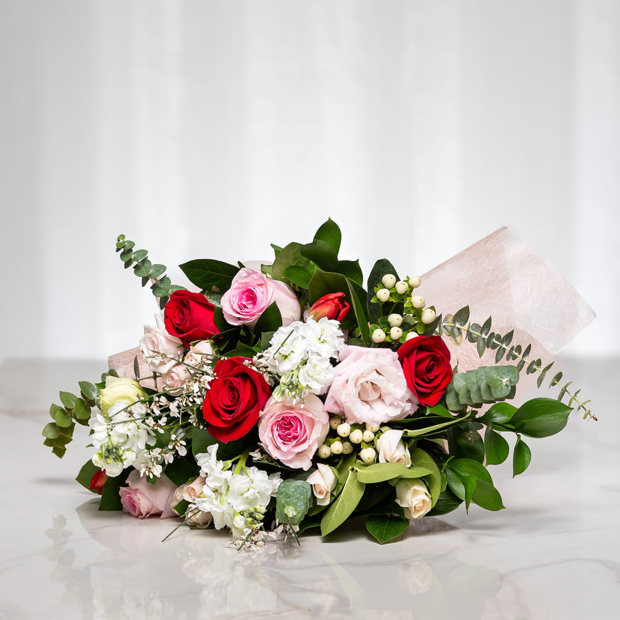 Forever Yours bouquet of red and pink roses with white blooms and eucalyptus