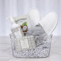 Fresh Favourites spa gift in a clear tub with coconut hand wash, a loofah, slippers and a towel