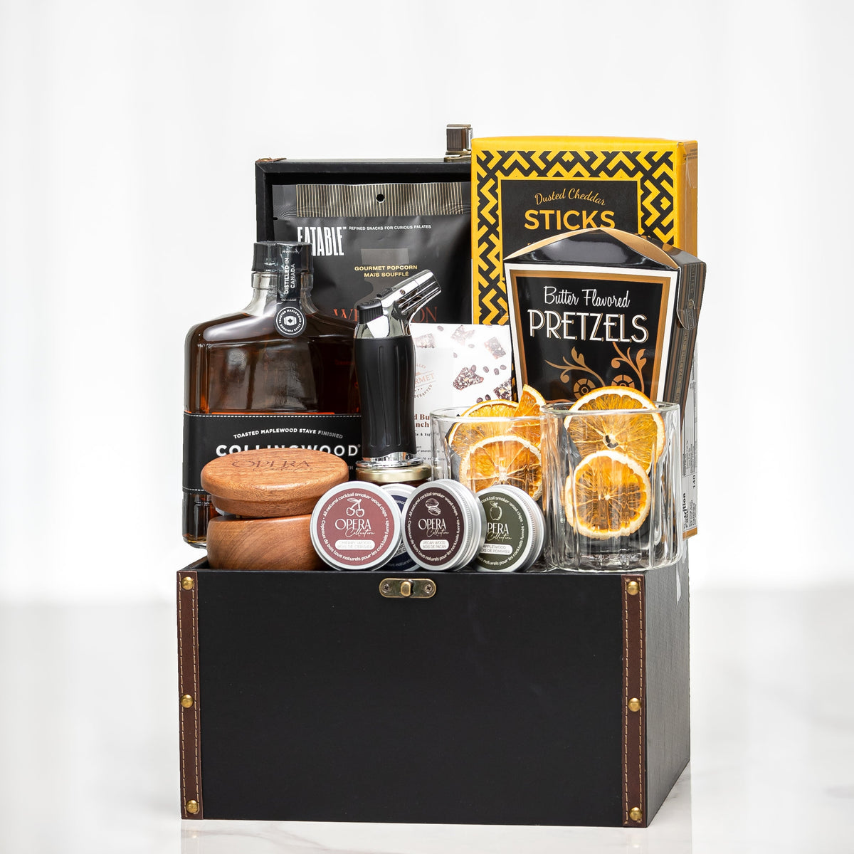 Gentleman's Pour gift box with a decanter, pretzel sticks, dried orange and savoury snacks