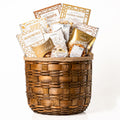 Hearty Hamper Medium: a round woven wood chip hamper filled with cookie crisps, salted pretzels, jujubes, Lindt Lindor truffles, cashews and caramel popcorn