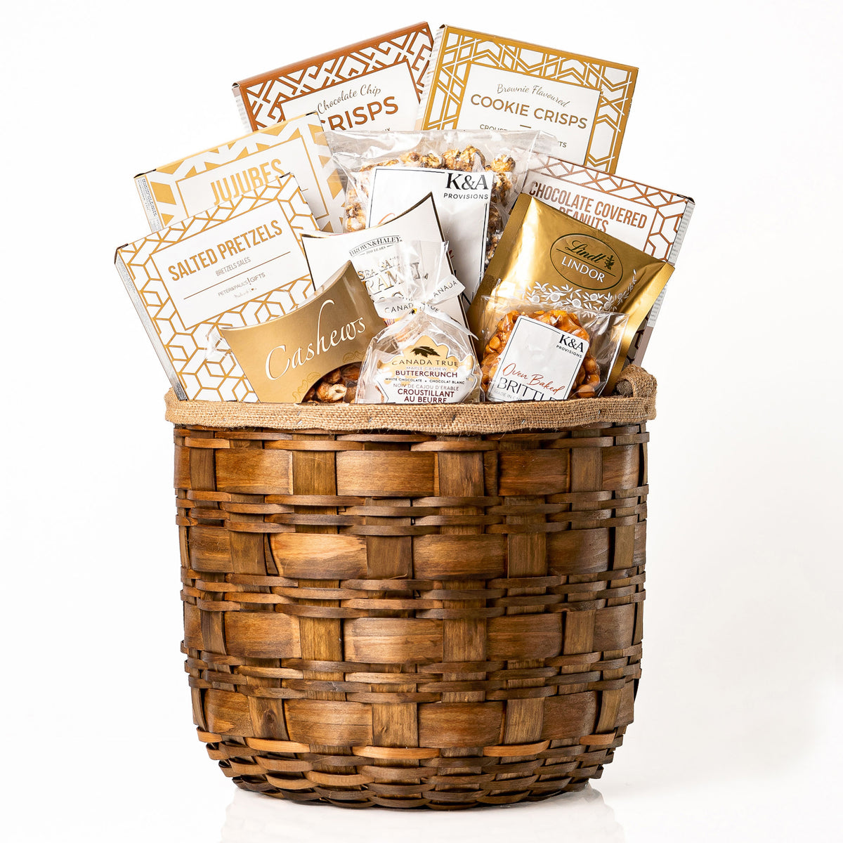 Hearty Hamper Medium: a round woven wood chip hamper filled with cookie crisps, salted pretzels, jujubes, Lindt Lindor truffles, cashews and caramel popcorn