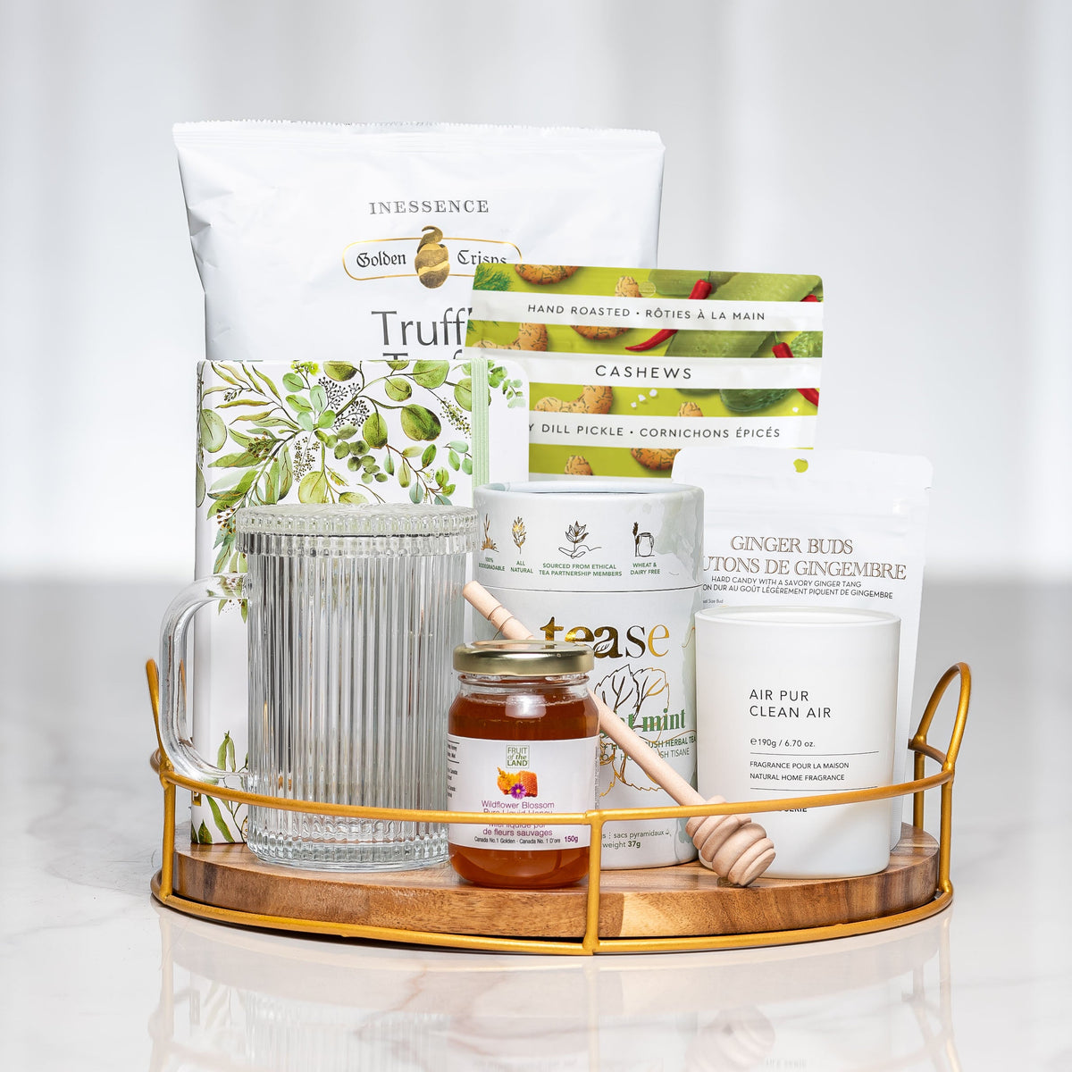 Herbal Harmony gift tray with tea, honey, a glass jar, hand cream and a honey dipper