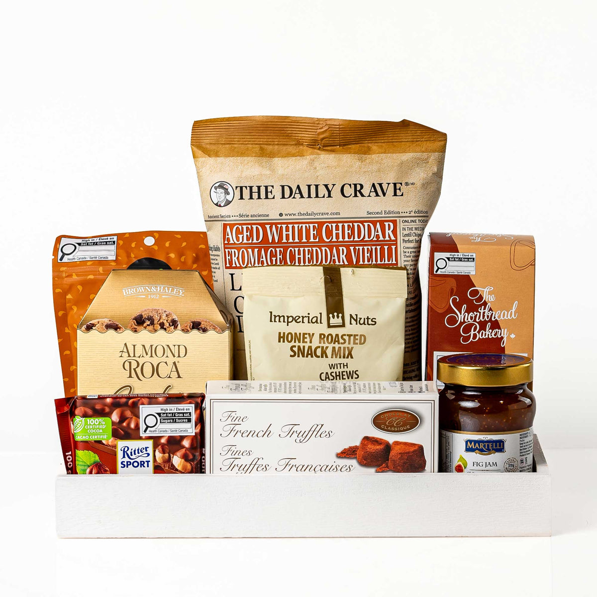 Kosher Kravings gift box with aged white cheddar crisps, almond roca, nuts and preserves