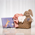 Lil Cottontail baby gift basket with the Velveteen Rabbit book, a plush bunny and pink outfits