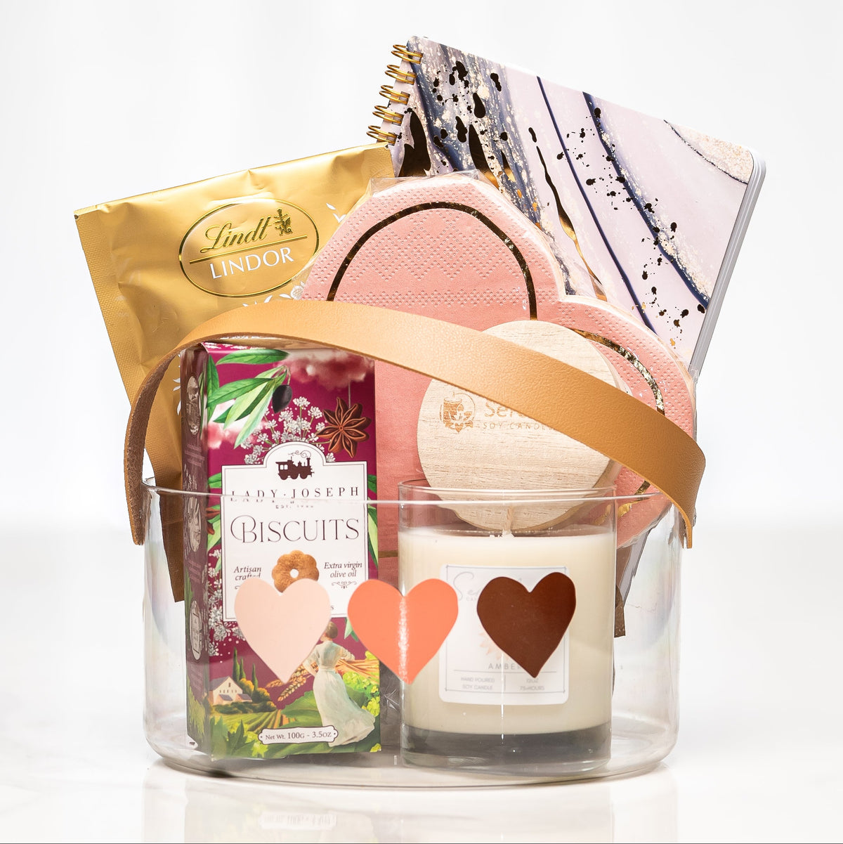 Love Notes gift with Lindt chocolate, biscuits, a heart candle and a notebook in a clear tub
