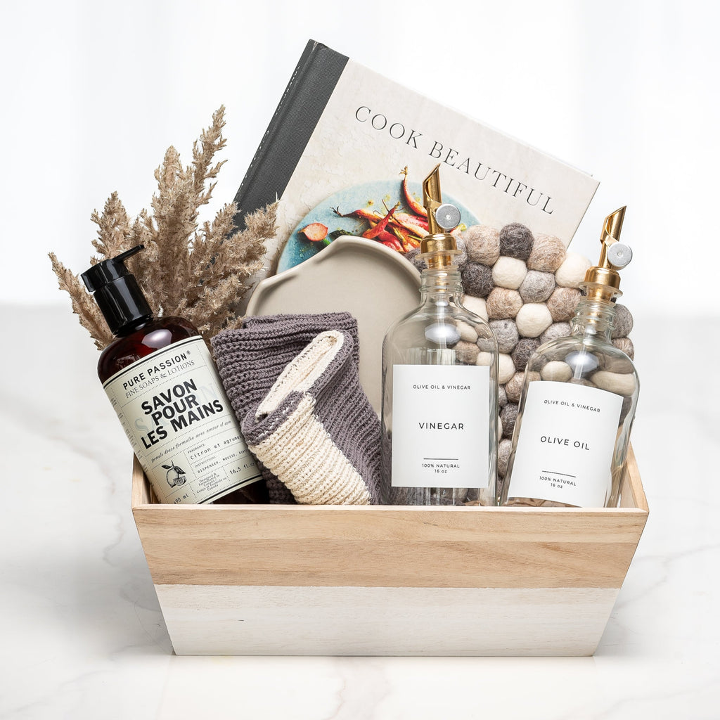 Maison gift crate with a Cook Beautiful book, a candle, hand wash, dried grasses and ceramics