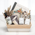 Maison gift crate with a Cook Beautiful book, a candle, hand wash, dried grasses and ceramics