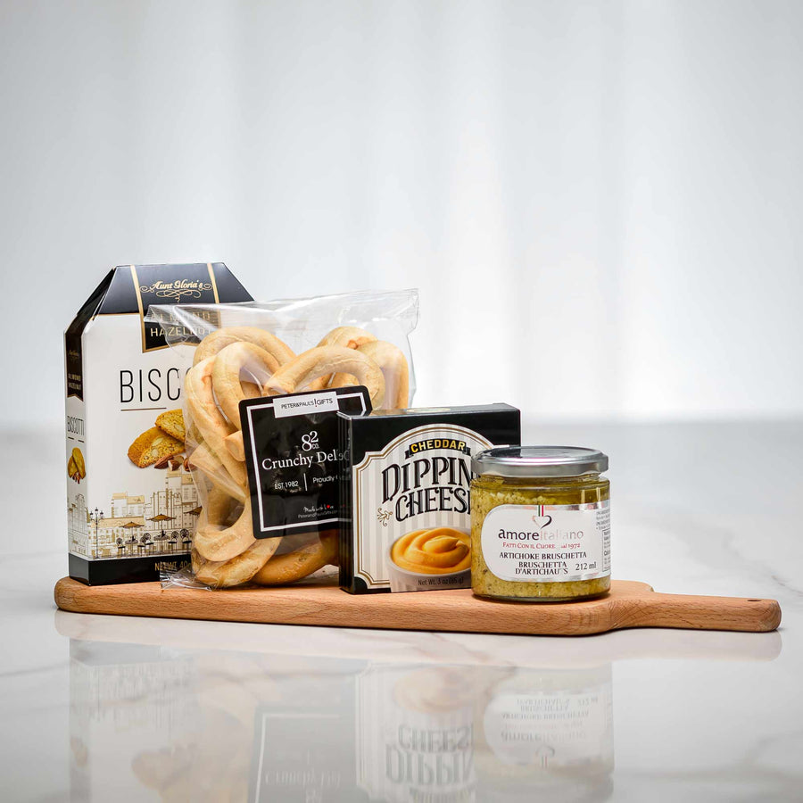 Mini Spread charcuterie gift on a wooden board with biscuits, Dippin Cheese, pretzels and preserves