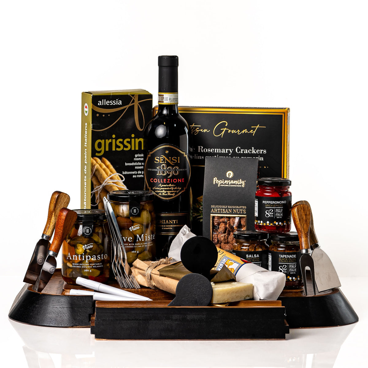 Perfect Pairing: an acacia serving board with a drawer of cheese knives, forks and chalkboard signs, with a bottle of Sensi Chianti, grissini, antipasto, olives, Parmigiano, chorizo and Co. 82 jars