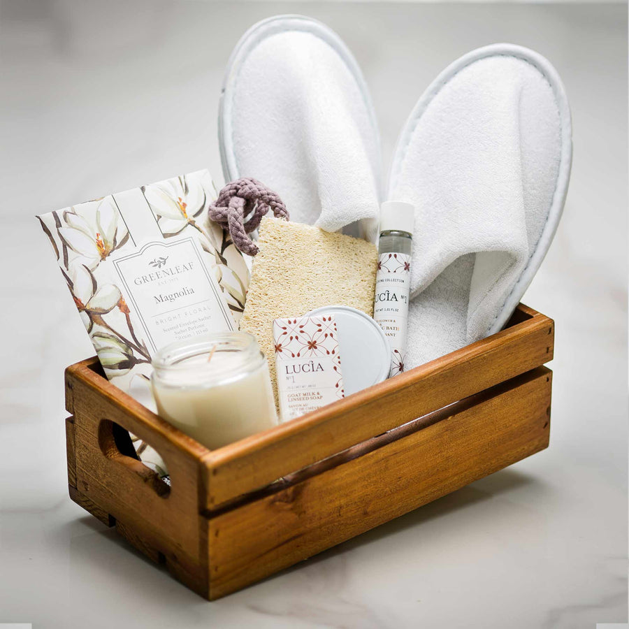 Relax and Recovery gift crate with white spa slippers, a Lucia candle, bath products and a card