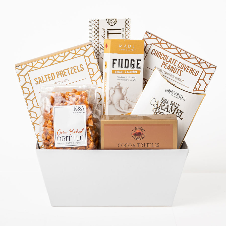 Sensational Snacks Small: a white gift tray with fudge, salted pretzels, chocolate covered peanuts, sea salt caramel roca, cocoa truffles and oven baked brittle