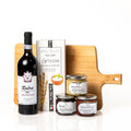 Sip n' Dip: a bamboo serving board with a bottle of Rubra Montepulciano d'Abruzzo, Artisan Gourmet sea salt grissini and three jars of Amore bruschetta