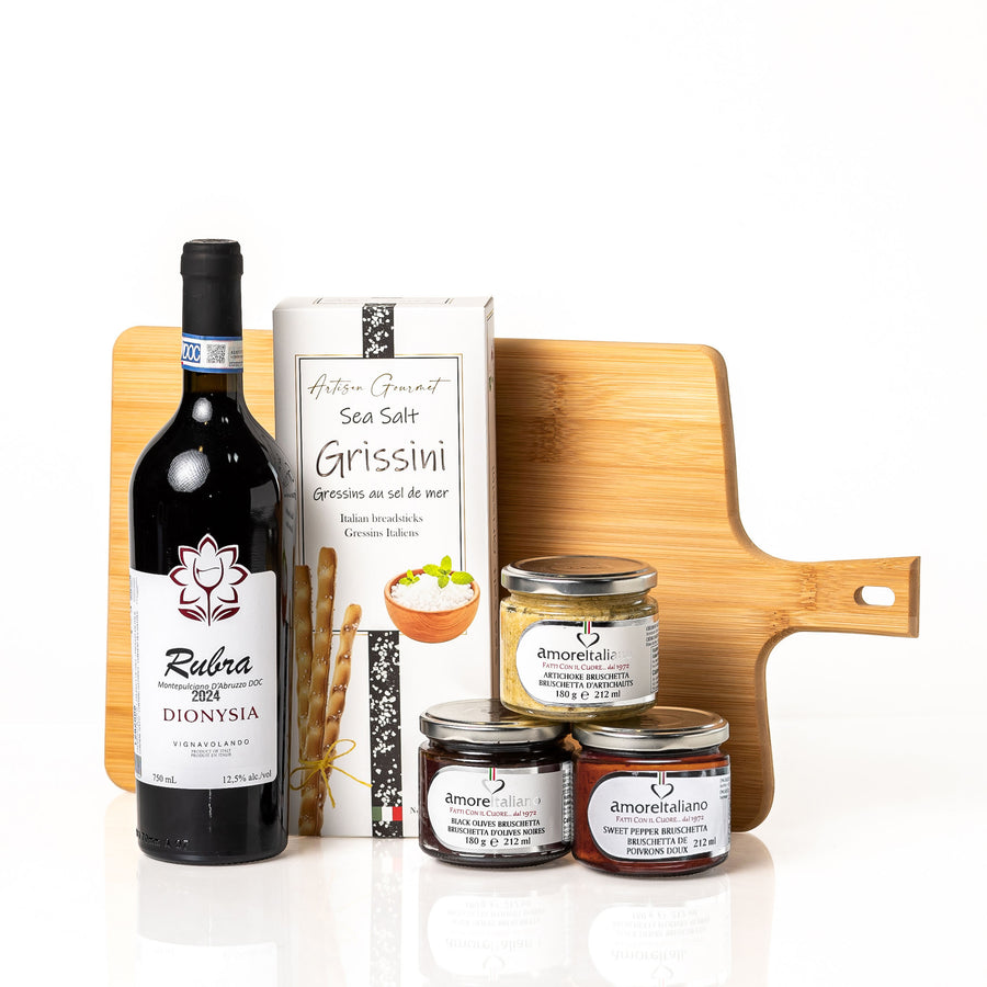 Sip n' Dip: a bamboo serving board with a bottle of Rubra Montepulciano d'Abruzzo, Artisan Gourmet sea salt grissini and three jars of Amore bruschetta