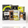 Snack Attack: a white serving tray with jujubes, mini pretzels, Mr Filbert's olive snacks, Co. 82 Euro mix, Snacktales snack mix, Tutti Gourmet biscotti and chocolate chip shorts