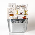 Snowflake: a silver planter with a snowflake design filled with mini pretzels, Laura Secord fudge, fine French truffles, mixed nuts, biscotti and Desobry chocolate biscuits
