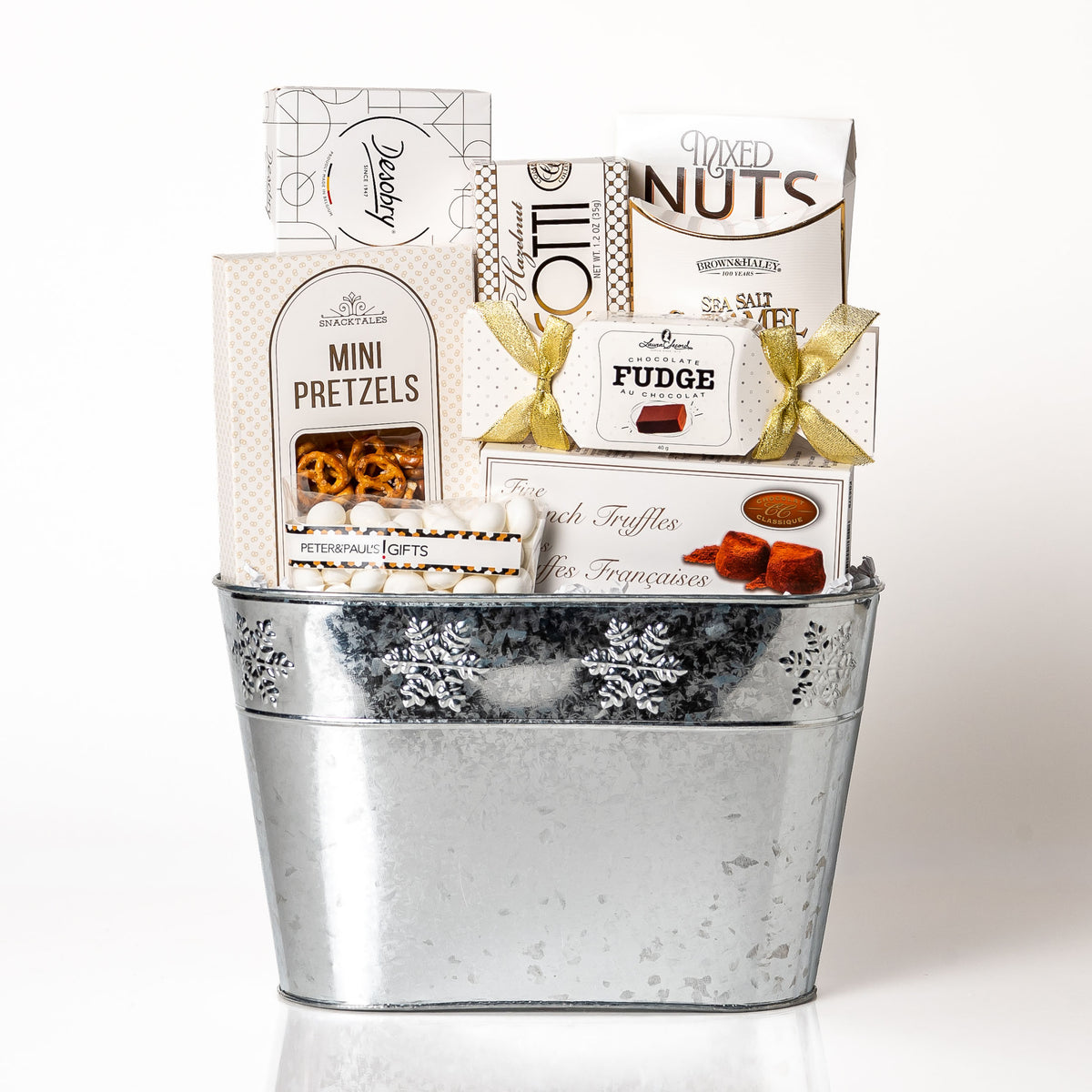Snowflake: a silver planter with a snowflake design filled with mini pretzels, Laura Secord fudge, fine French truffles, mixed nuts, biscotti and Desobry chocolate biscuits