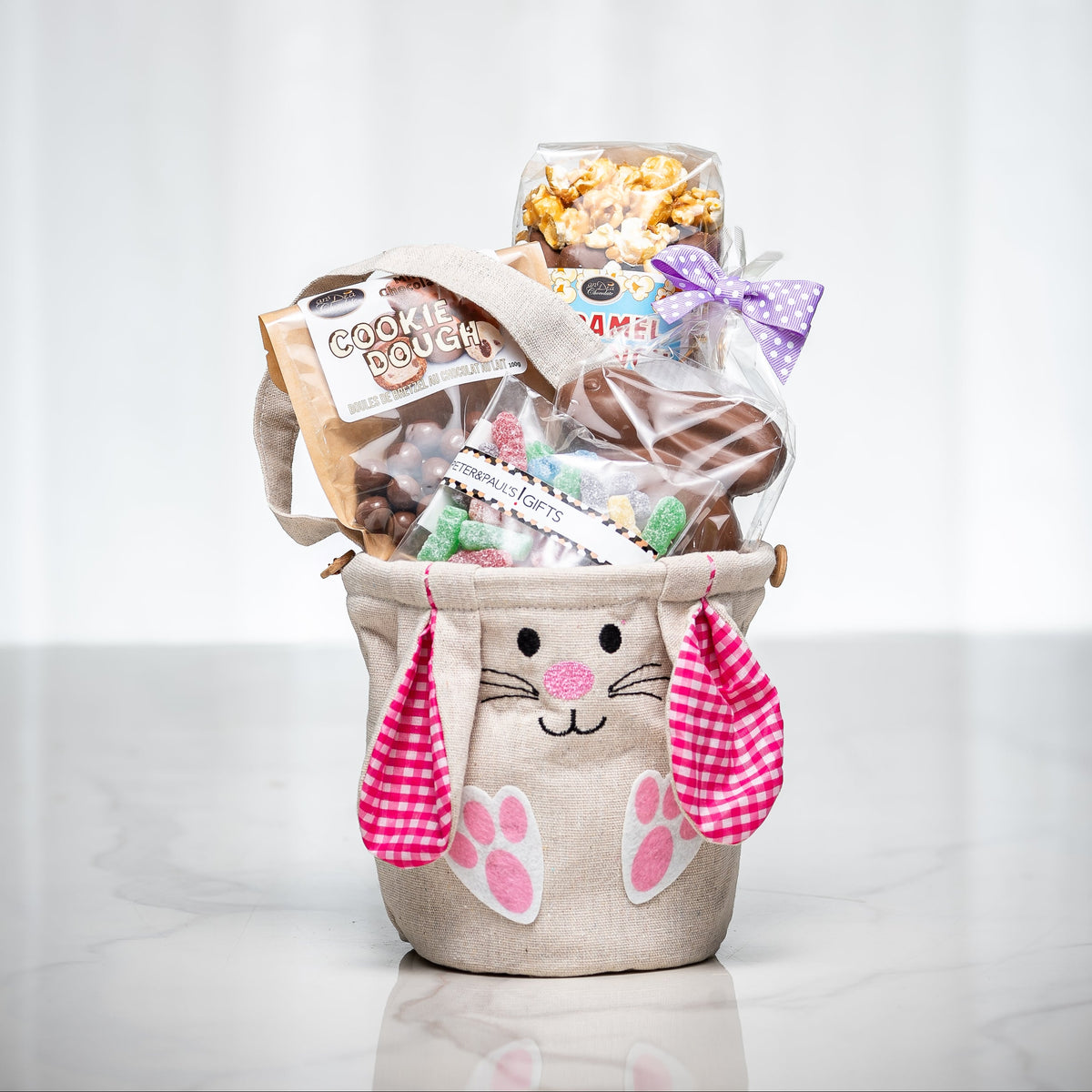 Some Bunny Loves You girl's gift in a bunny ear sack with popcorn, chocolates and treats