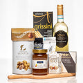 Toast and Taste gift with a bottle of white wine, grissini, truffle cream, cashews and brie