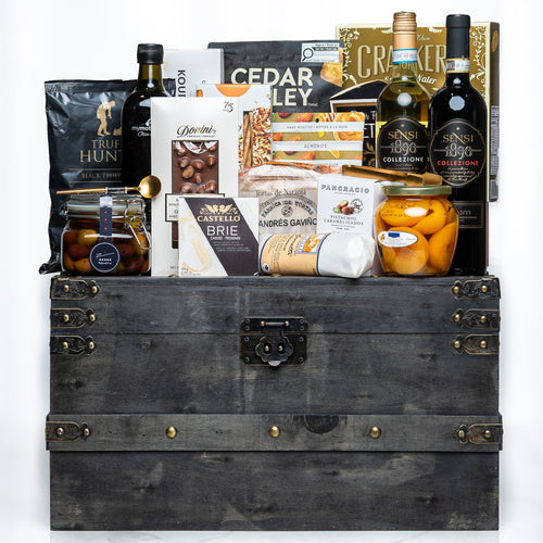 Treasure Trove medium dark trunk with Cedar Valley crackers, olive oil, brie and preserves