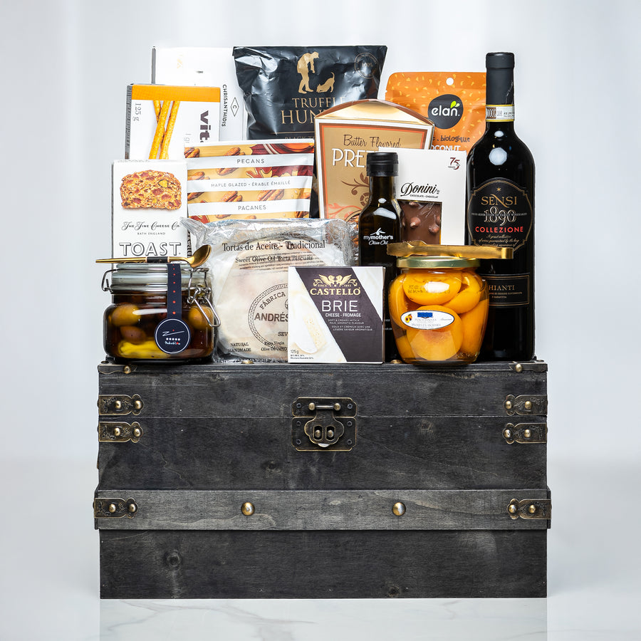 Treasure Trove small dark trunk with olive oil, preserves, crackers and gourmet snacks