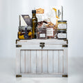 Ultimate Indulgence small white trunk with olive oil, preserves, chocolates and gourmet snacks
