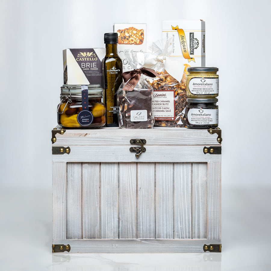 Ultimate Indulgence small white trunk with olive oil, preserves, chocolates and gourmet snacks