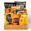 Vegan & Vibrant: a deep bamboo tray with Terra and Hardbite chips, Elan coconut, Panda licorice, Mike & Mike's organic apricots, Hippie Snacks cauliflower crisps and cashews
